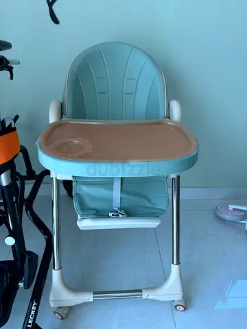 Used baby high chair with tray — light green good condition