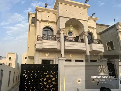 For sale in Al Zahia, Ajman: a villa featuring 5 bedrooms, a majlis, a living room, a spacious kitchen, and a maid's room.