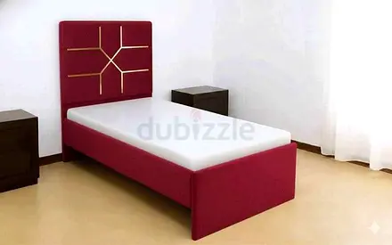 Single Red Upholstered Bed with Decorative Headboard