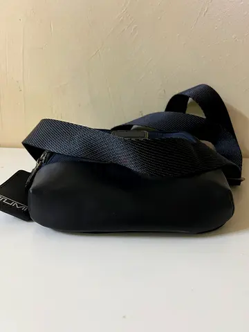 Tumi Black compact crossbody sling bag — lightweight everyday bag