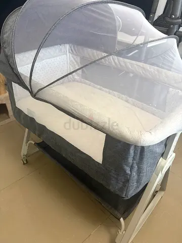 Portable baby bassinet with mosquito net - grey, once used