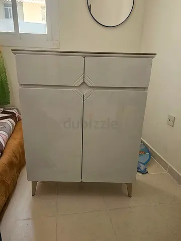 Compact white storage cabinet with drawers and doors also use shoe rack