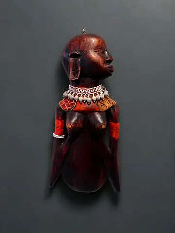 Hand-carved African wooden female figure with shell necklace — vintage wall hanging