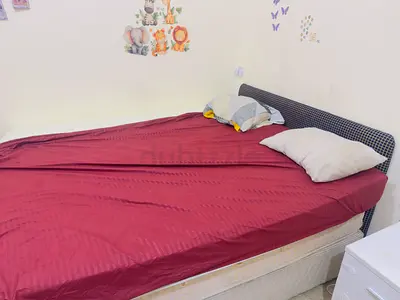 Queen size bed with mattress and headboard - good condition