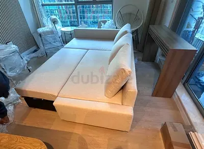 Beige L-shaped Sofa Bed with Storage — Good Condition
