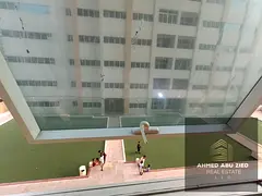 Studio apartment for annual rent in Ajman One Towers, Al Rashidiya 3, with a garden view, separate k