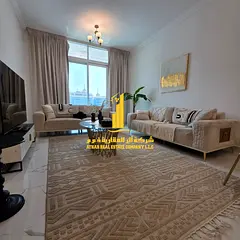 Luxury two-bedroom apartment with a living room in Ajman - Al Rashidiya 1 - Oasis Towers - furnished