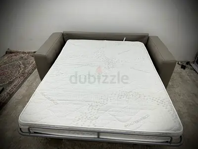 Like new condition Natuzzi two seater sofabed