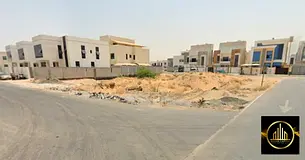 Two plots of land for corner villas on three streets in a prime location in Al-Yasmin, 800 square me
