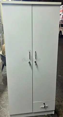 Were selling brand new two door cabinet solid wood
