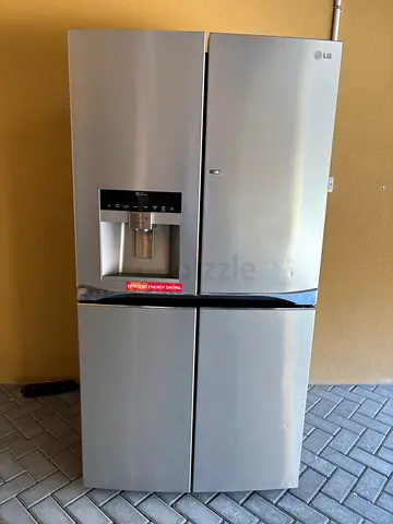 LG Side-by-Side Refrigerator and Freezer with Water Dispenser - Silver, Used