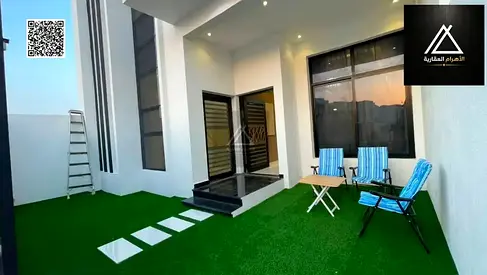 A furnished villa for sale directly from the owner, featuring a garden and equipped with electricity, water, and air conditioning. It boasts a Dubai-s