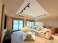 A fully furnished luxury apartment featuring two master bedrooms, a maid's room, four bathrooms,