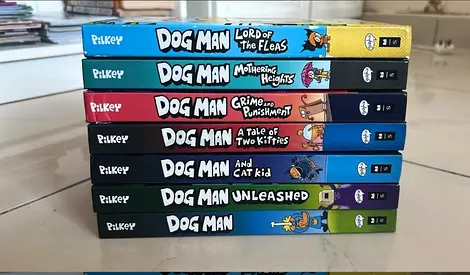 Set of 7 Dog Man graphic novels by Dav Pilkey - like new