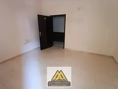 For annual rent in Al Nuaimiya 2, Ajman: a spacious studio with a balcony and central air conditioni