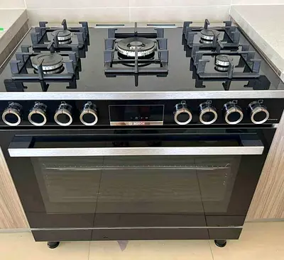 Bosch new model cooker full gas with fan digital like new condition perfect working 90/60 cm