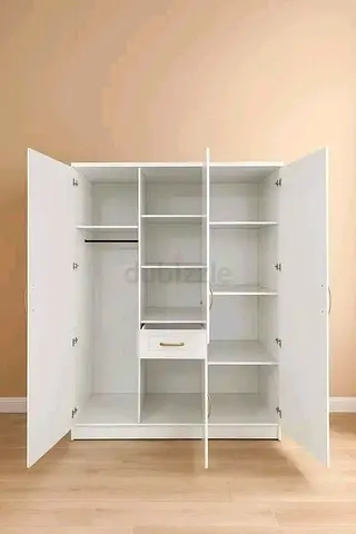 White Three Door Wardrobe with Shelves and Drawer