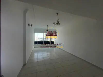 Annual Apartment for Rent Al Taawun Spacious 2-bedroom apartment with a large living room and a balcony in the pri