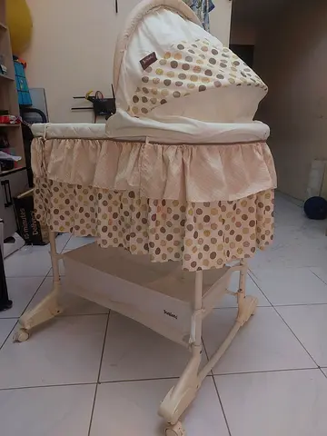 Used baby bassinet/cradle with canopy and storage  - good condition