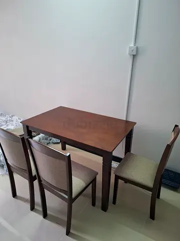 Solid wood 4-seater dining table with chairs - good condition