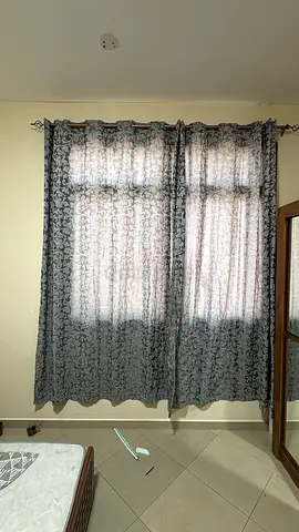 Pair of patterned grey curtains with blackout lining - good condition