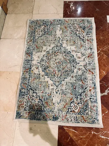 Used small vintage-look area rug, blue/cream medallion design