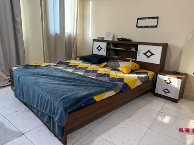 Double bed with headboard storage and matching bedside table - good condition