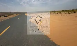 A small industrial plot of land, Al Qasimia City, Phase Four, with the final installment remaining t