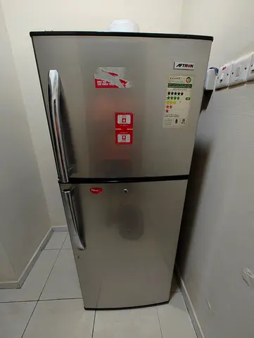 Used double-door refrigerator - good condition, stainless steel finish