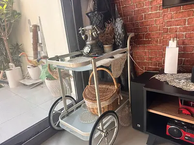 Vintage-style serving trolley with metal frame and wheels