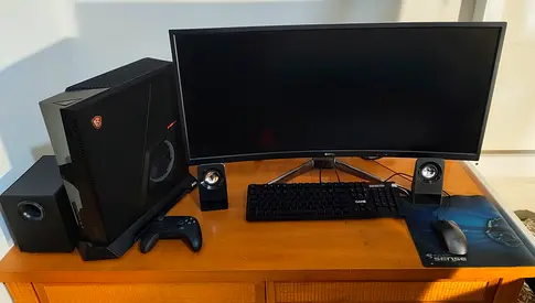 Gaming Desktop Setup with Curved Monitor, Speakers and Accessories