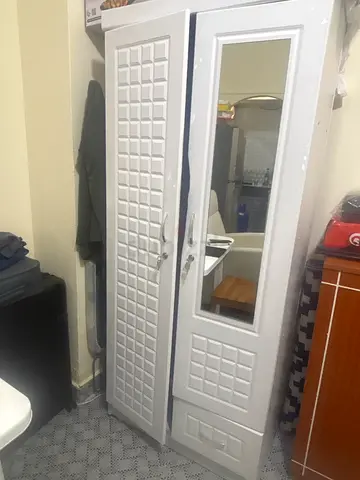 Double door Wooden wardrobe with mirror for AED 150