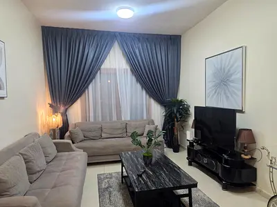 Brand new apartment, first tenant, with completely new furniture. One bedroom and a living room in Abu Shagara, directly on the Dubai exit, featuring