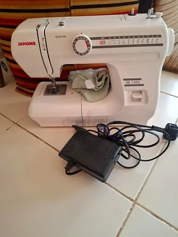 Janome RE1306 Sewing Machine with Foot Pedal  and extra accessories- Good Working Condition