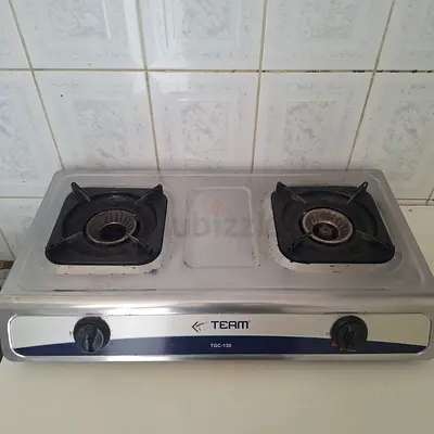 Two-burner stainless steel gas stove - used, working with LPG cylinder