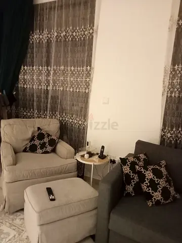 Two Comfortable Armchairs with Ottoman and Side Table - Good Condition