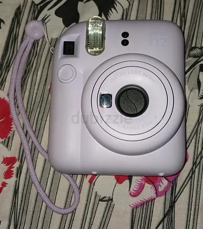 Fujifilm Instax Mini 12 Instant Camera - Lilac Purple in excellent condition.
