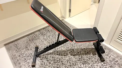 Adjustable weight bench — incline/flat workout bench in good condition