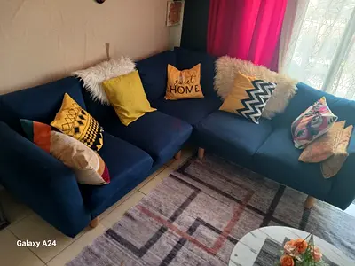 Blue L-shaped Fabric Sofa - Good Condition, Wooden Legs