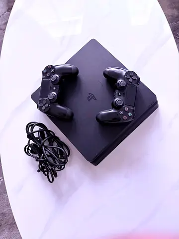 Sony PS4 Slim with 2 DualShock Controllers and Cables - Good Condition