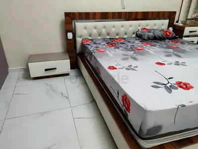 Urgent sale of King size bed with 2 mattress and small table