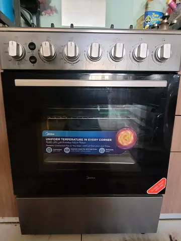 Midea freestanding gas cooker with oven — good working condition