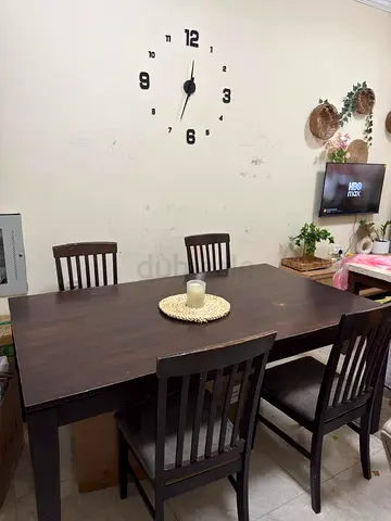 Used Dining Table with Four Chairs for sale.