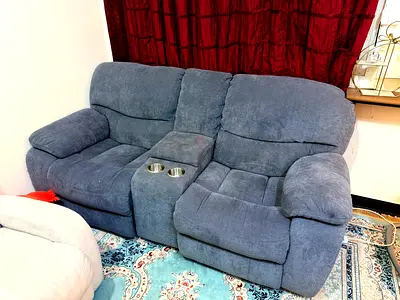 Grey 2-seater reclining sofa with cup holders and charging slots (usb)