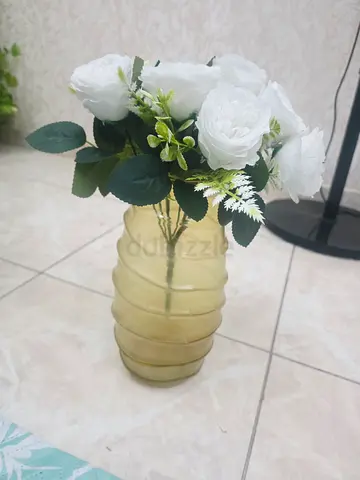 Glass ribbed vase with artificial white roses - decorative centerpiece