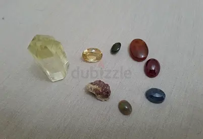 Small mixed gemstone and crystal lot — citrine, agate, sapphire, garnet fragments