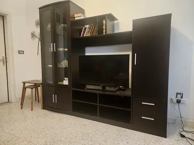 Dark wood entertainment center / TV unit with storage (good condition)