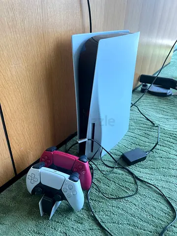 PS 5 with disk drive, two controllers and 4 games