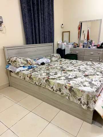 King-size wooden bed frame with headboard in light grey (good condition)