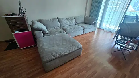 Modular feather filled sofa with footstool